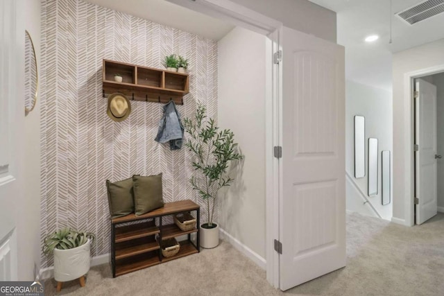 mudroom with light colored carpet