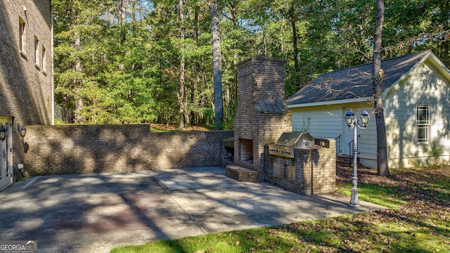 view of patio featuring grilling area and an outdoor kitchen