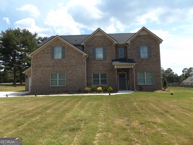 view of front of home featuring a front lawn