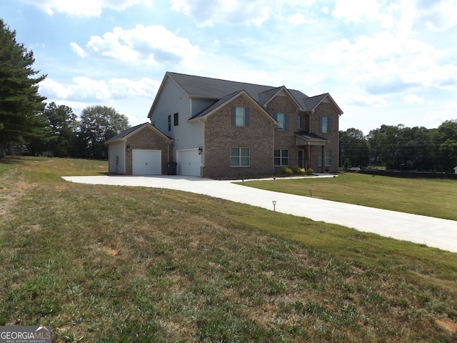 view of front of house with a garage and a front yard