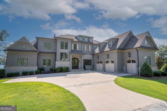 view of front of house with a garage and a front yard