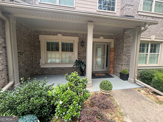 doorway to property with covered porch