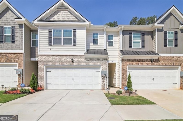 townhome / multi-family property featuring a garage