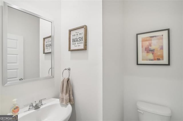 bathroom with a sink and toilet