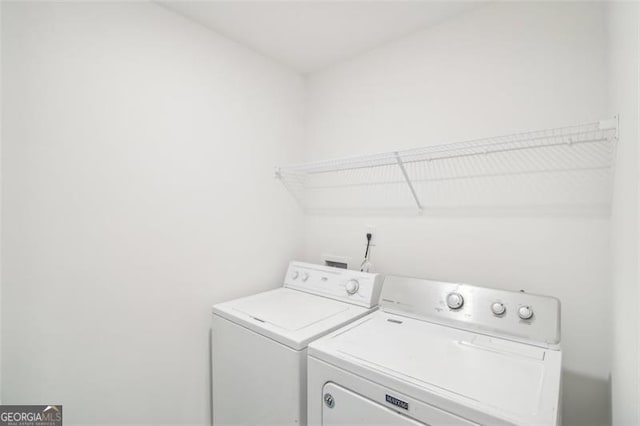 clothes washing area featuring laundry area and independent washer and dryer