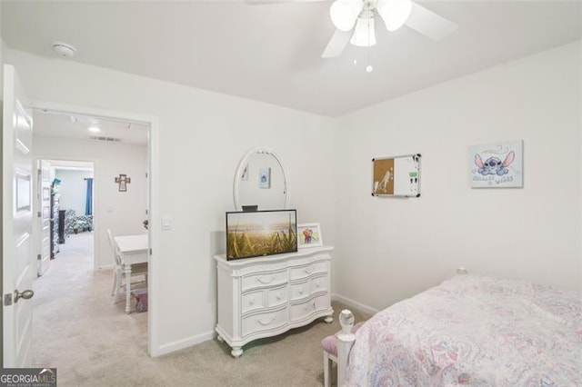 carpeted bedroom featuring visible vents, baseboards, and ceiling fan