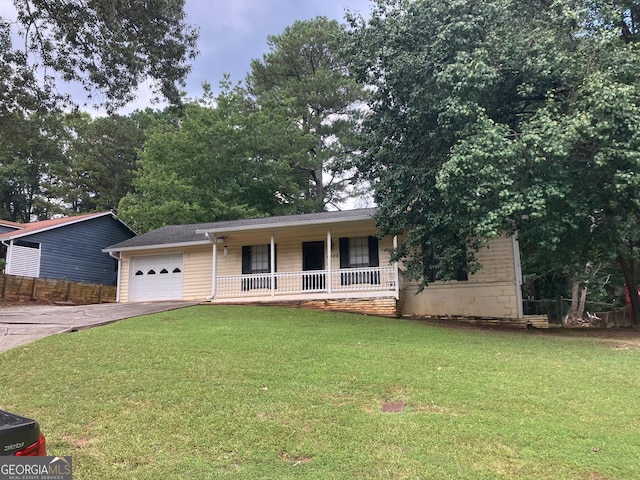 single story home with a porch, a garage, and a front yard