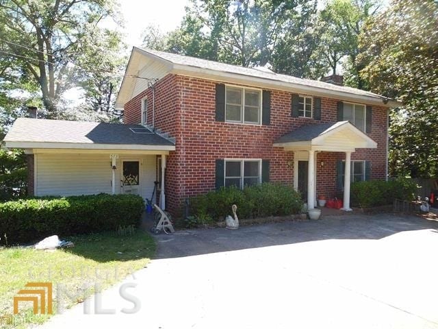 573 Lester Rd, Fayetteville, GA 30215 - colonial-style house with brick siding