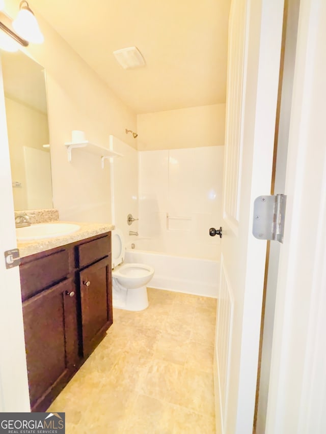 full bathroom featuring toilet, bathtub / shower combination, and vanity