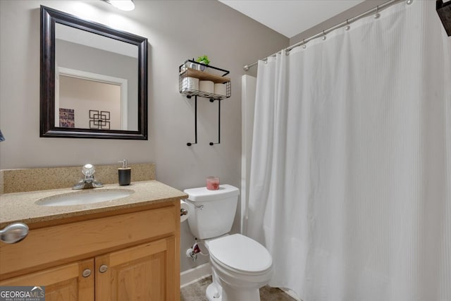 bathroom featuring a shower with curtain, toilet, and vanity