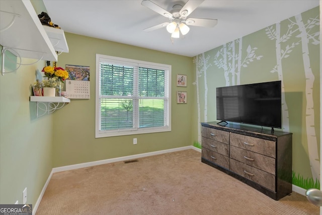 carpeted bedroom with ceiling fan