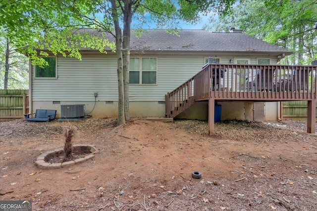 back of property featuring a deck and central air condition unit