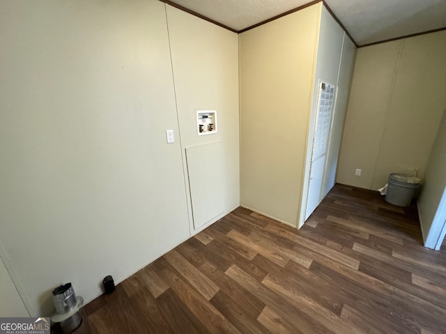 laundry room featuring washer hookup, dark wood-type flooring, and a textured ceiling