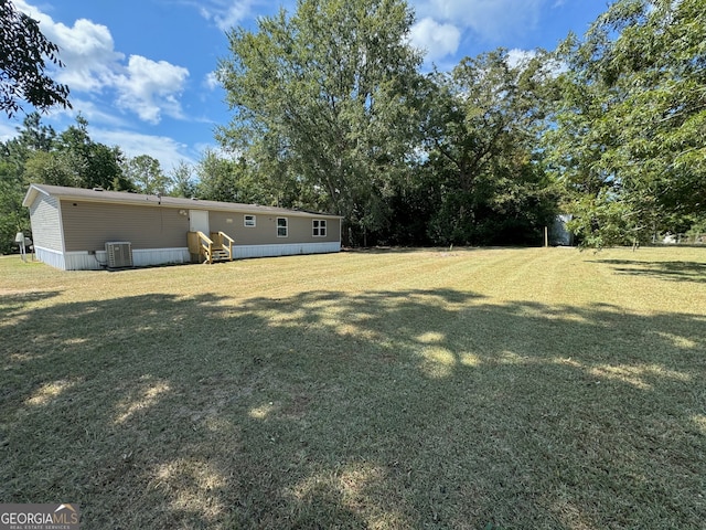 view of yard with central AC unit