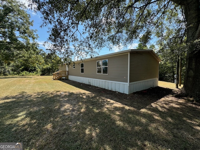 view of home's exterior featuring a yard