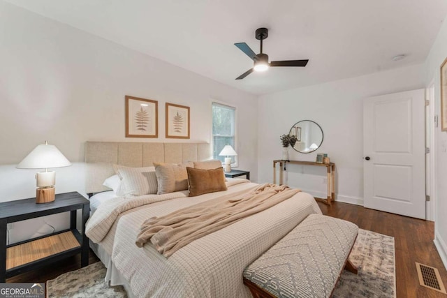 bedroom with dark wood-type flooring and ceiling fan