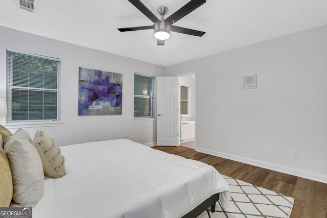 bedroom featuring ceiling fan and dark hardwood / wood-style flooring