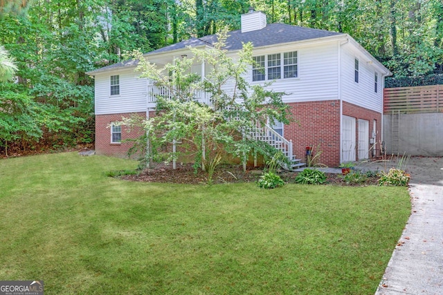 view of front facade with a garage and a front lawn