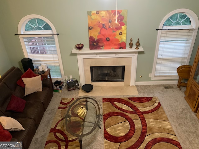 tiled dining room with ceiling fan and crown molding