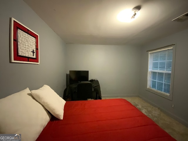 carpeted bedroom featuring ceiling fan, crown molding, and a tray ceiling