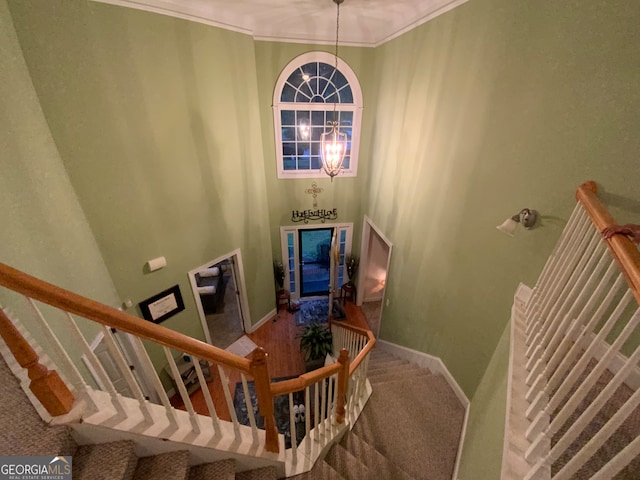 hallway featuring light carpet and crown molding