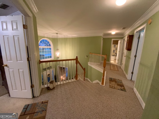 stairway featuring a towering ceiling, a chandelier, and carpet