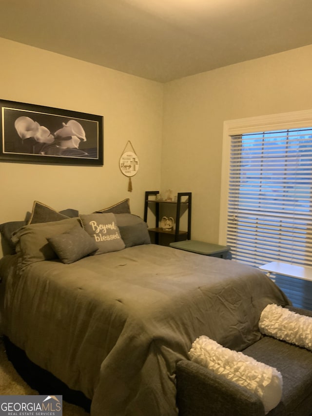 corridor featuring light colored carpet and crown molding