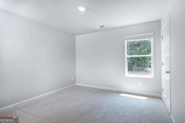 unfurnished room with carpet floors