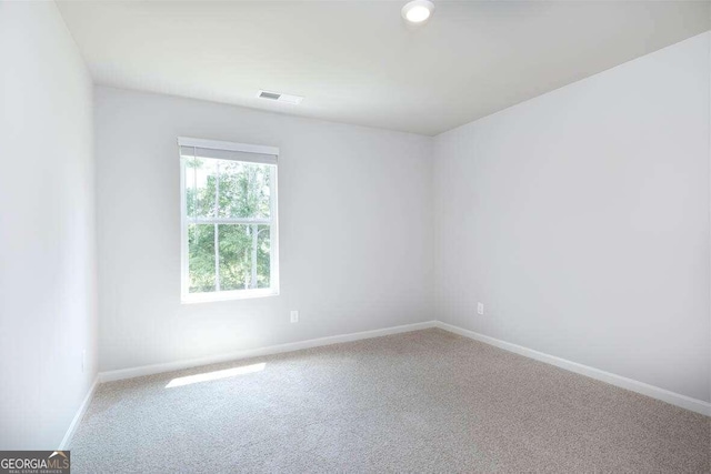 empty room with carpet flooring