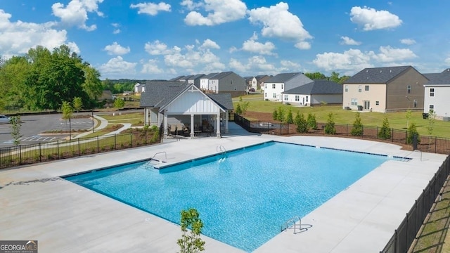 view of swimming pool with a patio area