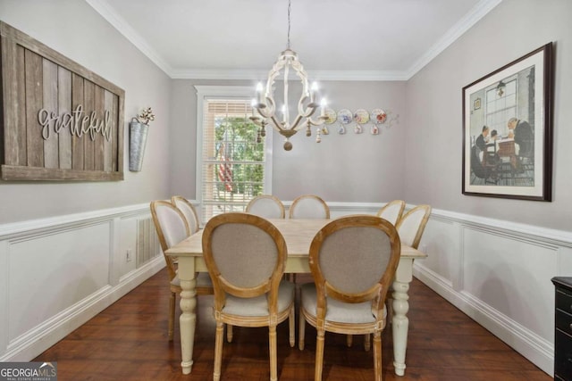 dining room featuring a wainscoted wall, a notable chandelier, dark wood-style floors, and crown molding