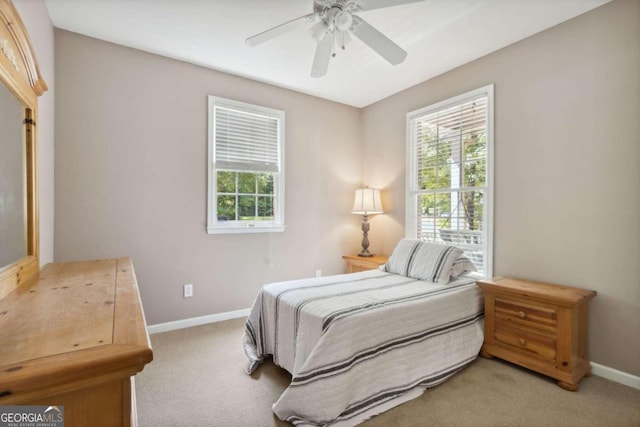 bedroom featuring baseboards, ceiling fan, and carpet flooring