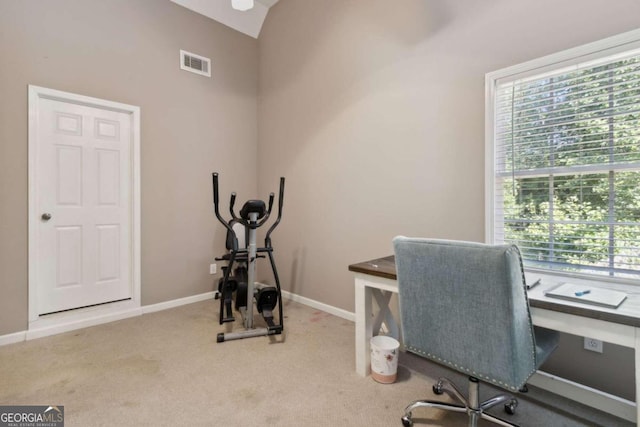 office with visible vents, baseboards, carpet, and lofted ceiling