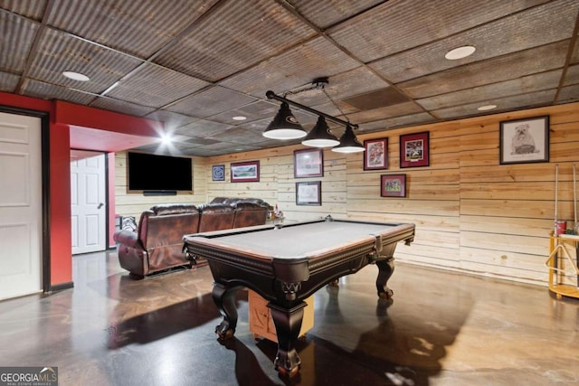 playroom with finished concrete floors and billiards