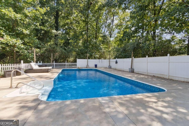 view of pool with a patio area, a fenced in pool, and a fenced backyard