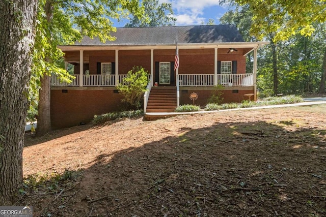 view of front facade with crawl space and covered porch