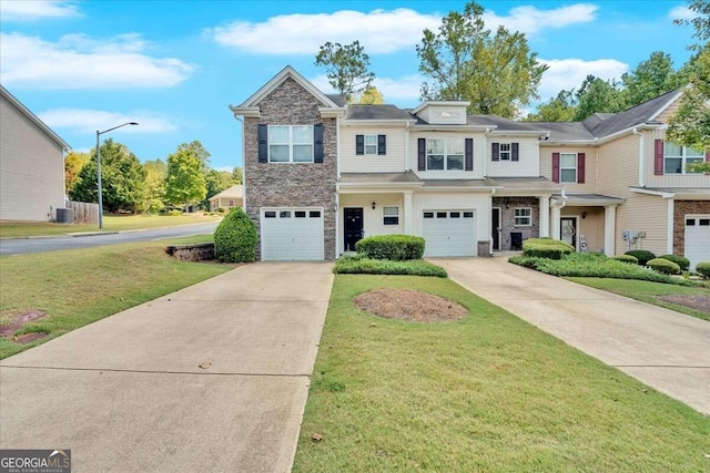 view of front of house with central air condition unit, a garage, and a front lawn