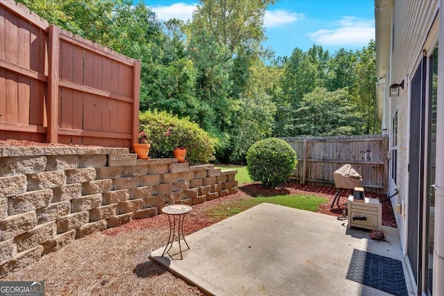 view of patio featuring fence