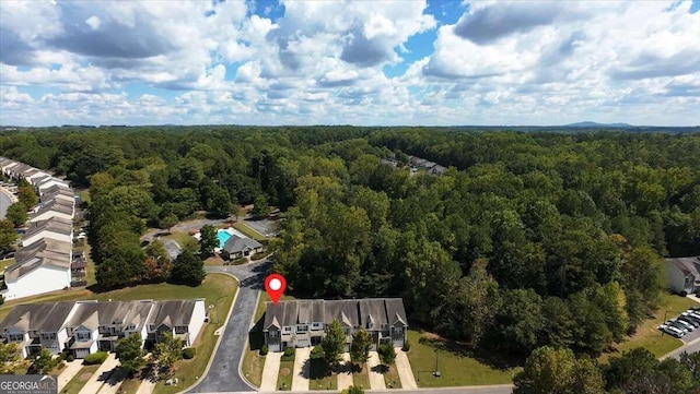 aerial view with a residential view and a wooded view