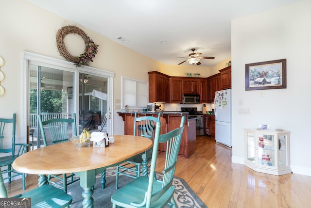 dining room featuring light hardwood / wood-style flooring and ceiling fan