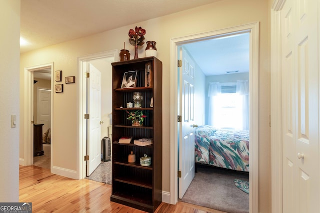 hallway featuring light hardwood / wood-style flooring