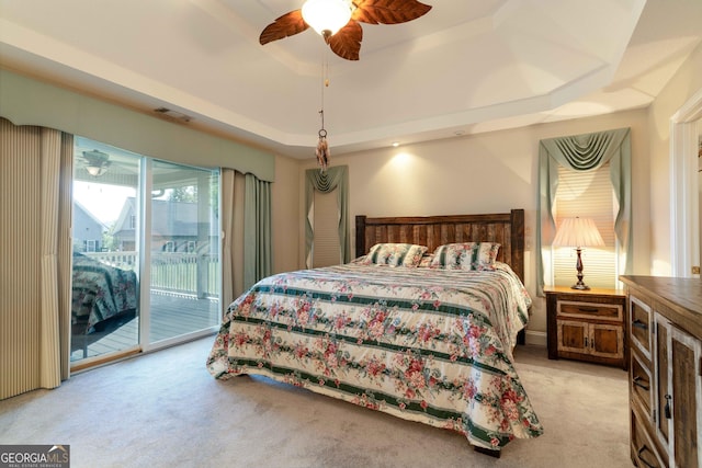 199 Colonsay Trce, Blairsville, GA 30512 - bedroom featuring visible vents, a tray ceiling, ceiling fan, access to outside, and light colored carpet