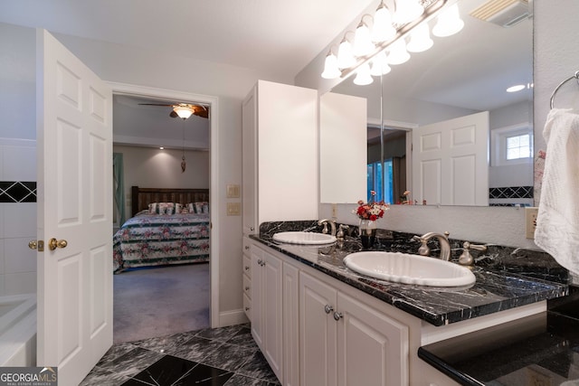 bathroom featuring vanity and ceiling fan