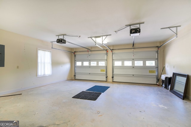 garage featuring electric panel and a garage door opener