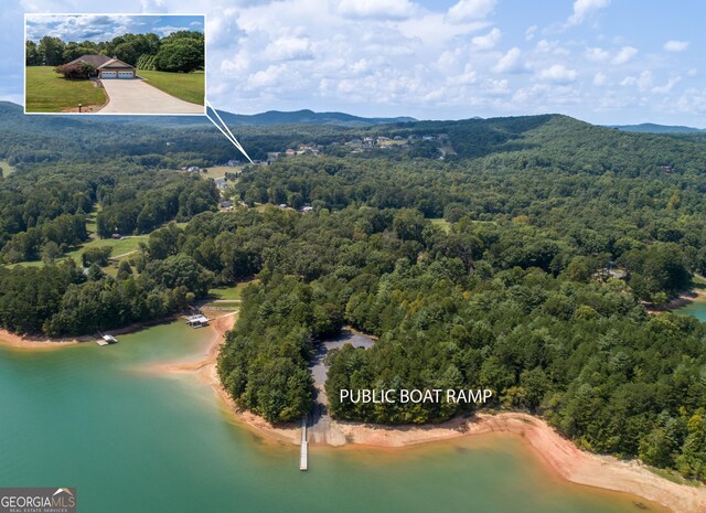 bird's eye view featuring a water and mountain view