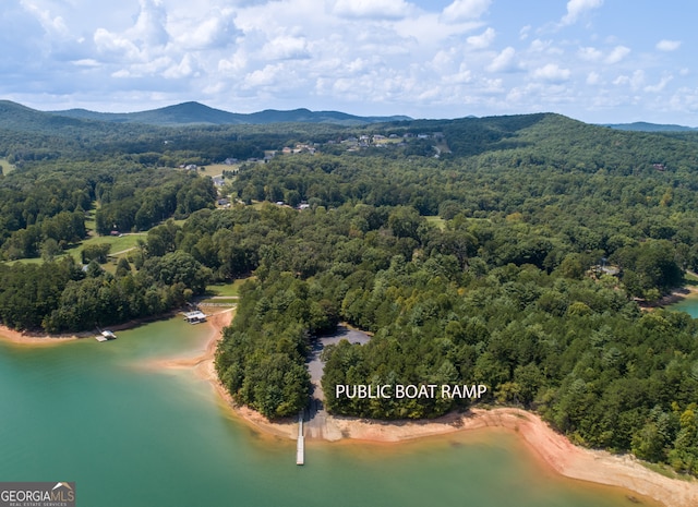 bird's eye view featuring a water and mountain view