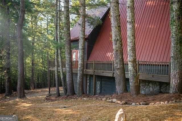 view of side of property with a deck