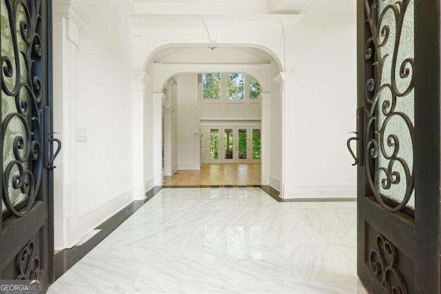 foyer with wood-type flooring