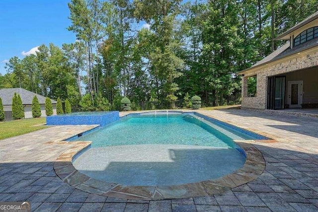 view of swimming pool featuring a patio