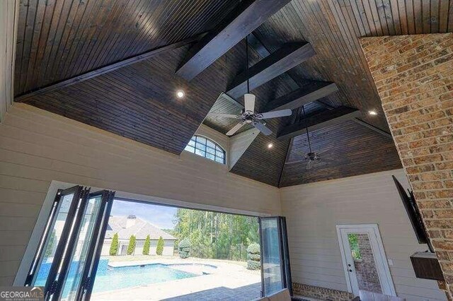 details featuring wooden ceiling, beam ceiling, and ceiling fan